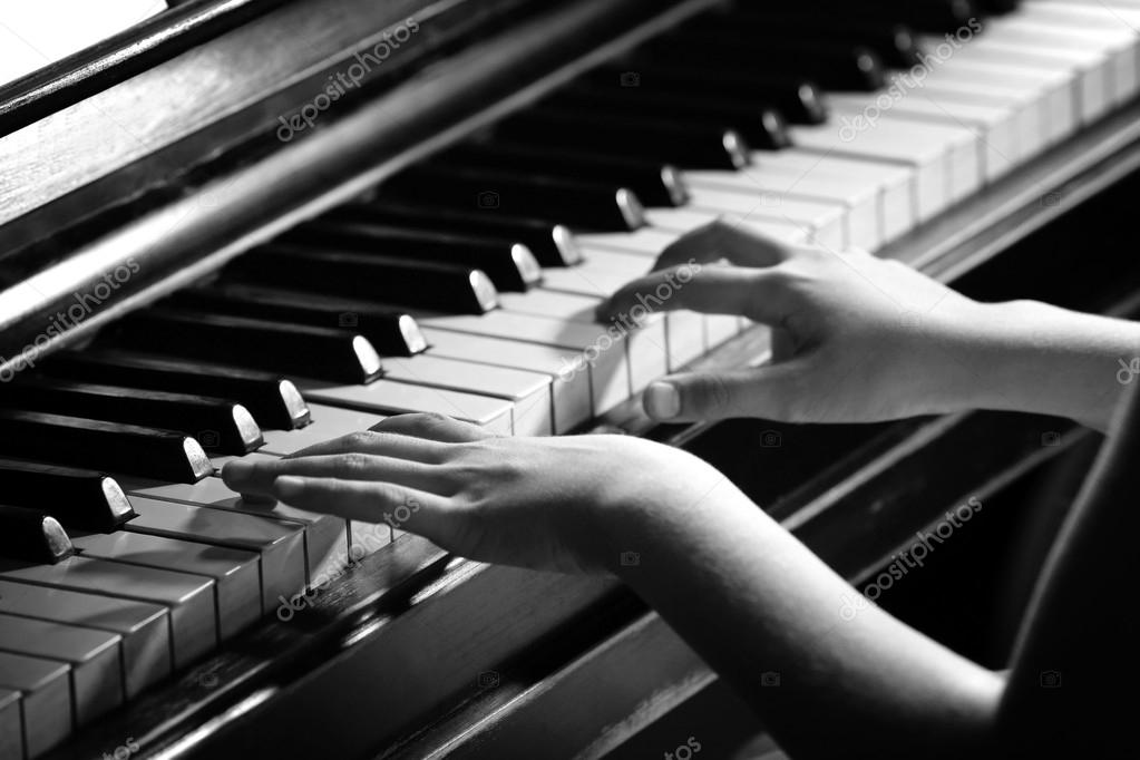 Little girl hands piano playing — Stock Photo © belchonock 87861344