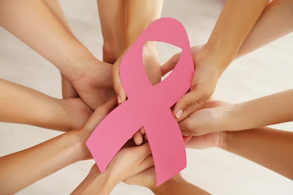 Hands holding breast cancer symbol — Stock Photo, Image