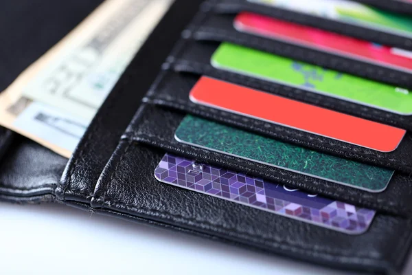 Black leather wallet with colourful credit cards — Stock Photo, Image