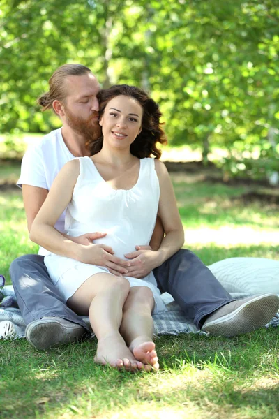 Happy Couple Embrace Sitting White Blanket Park — Stock Photo, Image