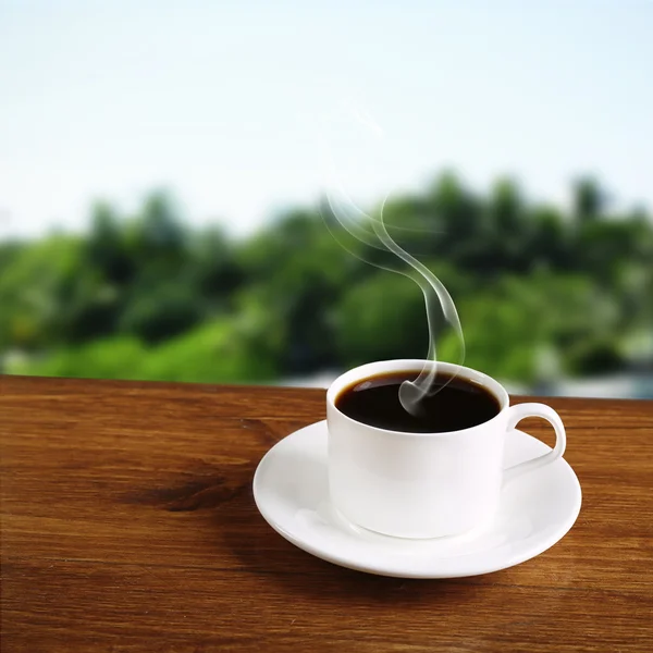 Taza de café en la mesa —  Fotos de Stock