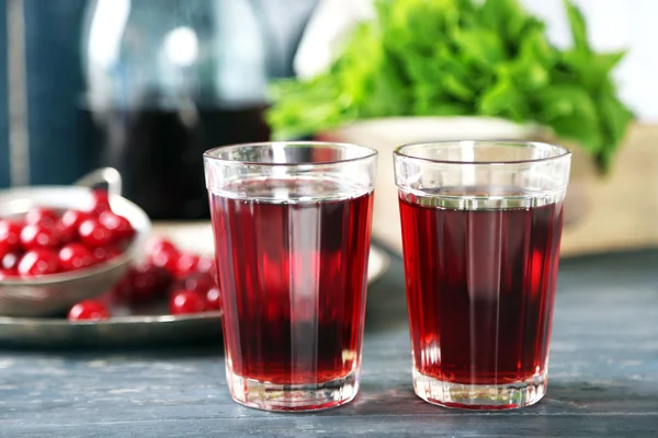 Sweet homemade cherry juice on table — Stock Photo, Image