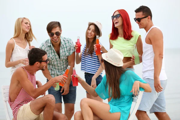 Beautiful people having fun on beach — Stock Photo, Image
