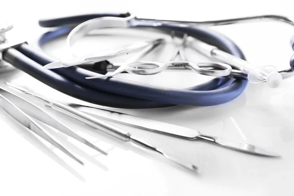 Stethoscope and surgery instruments — Stock Photo, Image