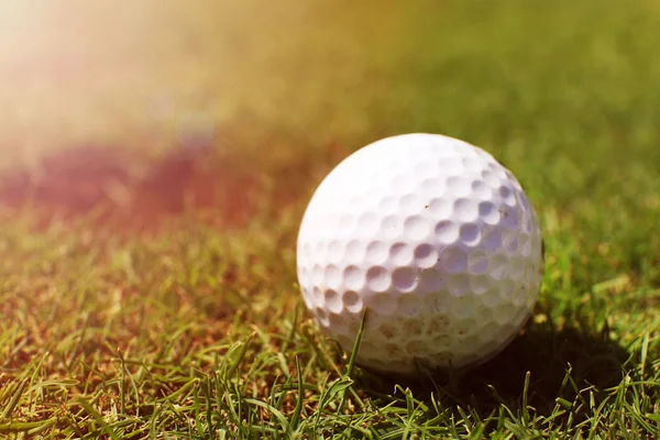 Golf ball on lip of cup — Stok fotoğraf