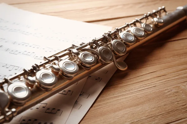 Silver flute with music notes — Stock Photo, Image