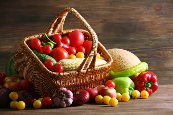 Heap of fresh fruits and vegetables on wooden background — Stock Photo, Image