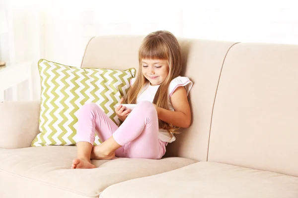 Beautiful little girl with smart phone — Stock Photo, Image