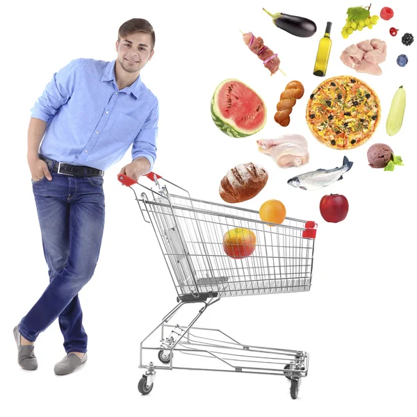 Young man pushing shopping cart — Stock Photo, Image