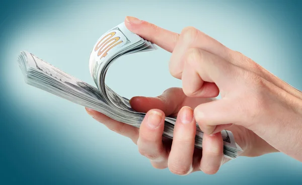 Female hand holding dollars — Stock Photo, Image