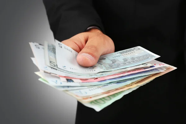 Male with euro in hand — Stock Photo, Image