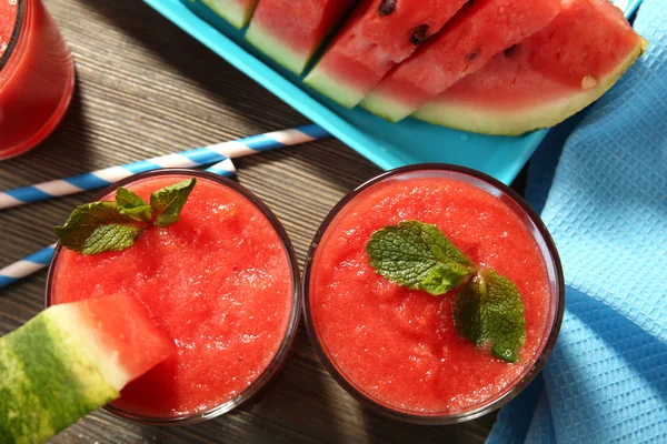 Glasses of watermelon juice on wooden table, top view — Stock Photo, Image