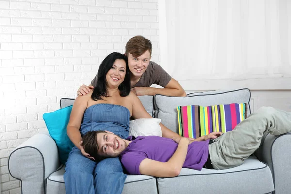 Happy family portrait on sofa — Stock Photo, Image