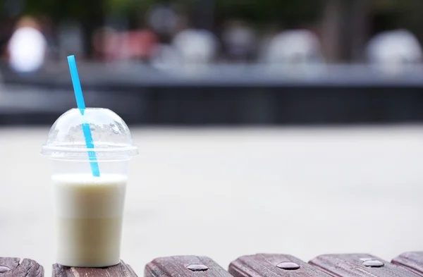 Plastic cup of milkshake — Stock Photo, Image