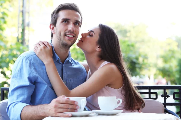 Young couple in street cafe — Stock Photo, Image