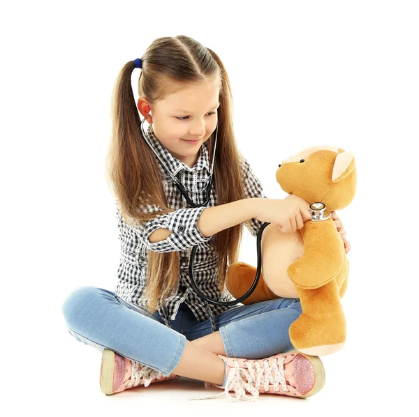 Beautiful little girl with teddy bear Stock Picture