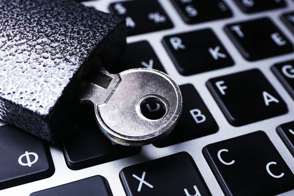 Lock on the laptop keyboard background, close up — Stock Photo, Image