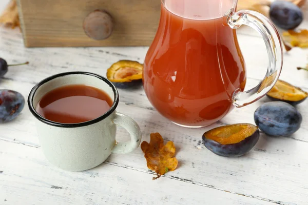 Plum Juice in jar and mug with fresh fruits — Stock Photo, Image