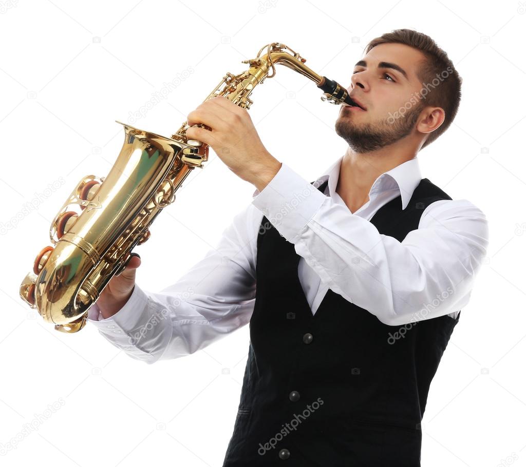 Happy saxophonist plays music on sax in elegant suit on white background