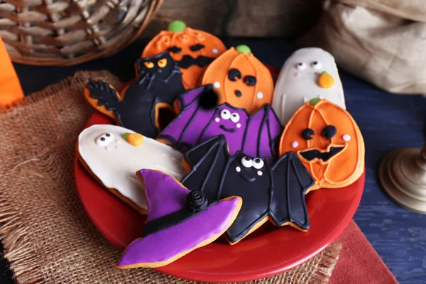 Halloween cookies on red plate — Stock Photo, Image