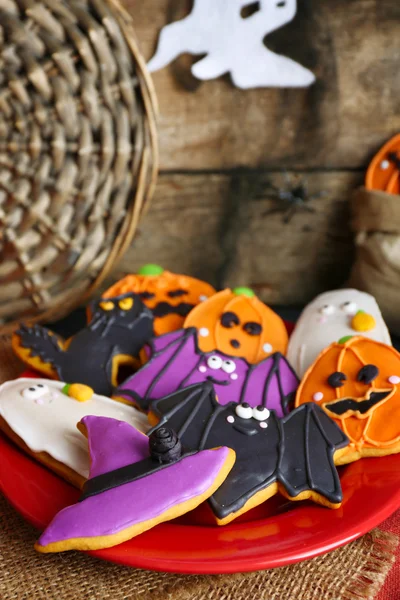 Halloween cookies on red plate — Stock Photo, Image