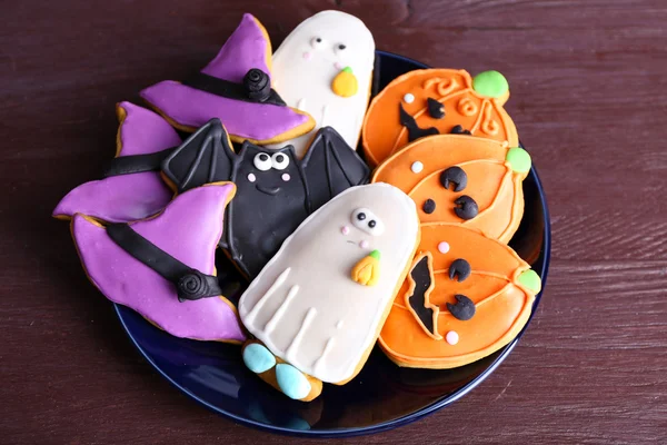 Halloween cookies on black plate — Stock Photo, Image