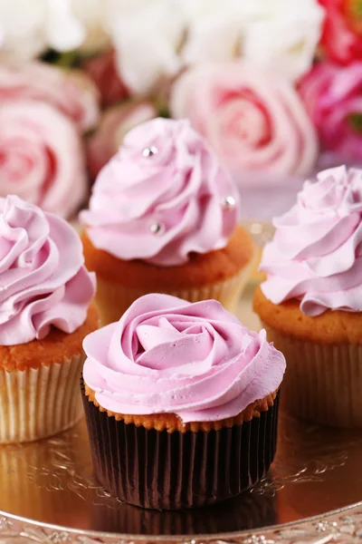 Tasty cupcakes on bright background — Stock Photo, Image