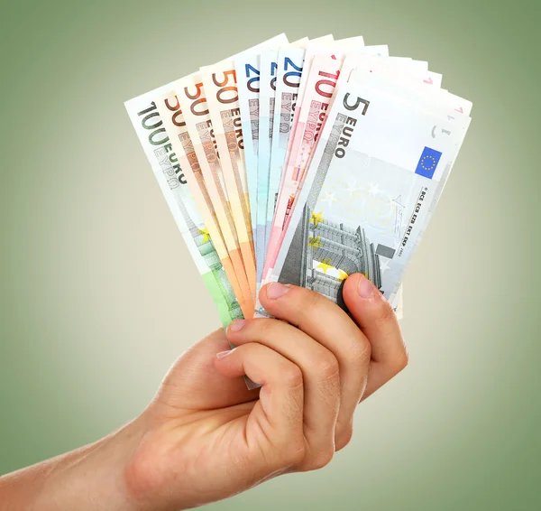 Euro banknot ile el — Stok fotoğraf