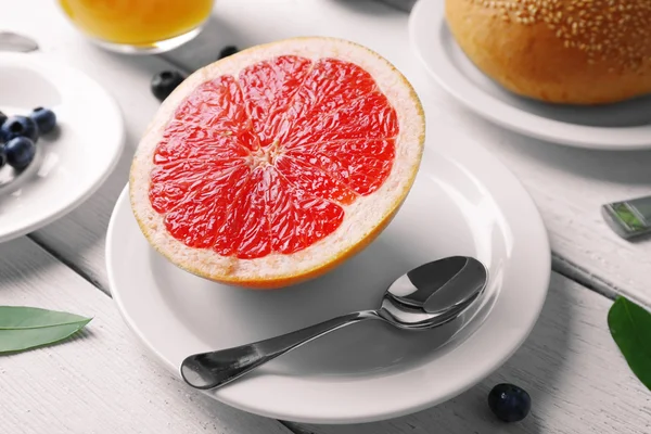 Fresh half of grapefruit on table — Stock Photo, Image