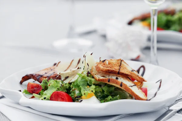 Tasty salad with wine — Stock Photo, Image