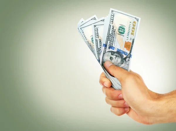 Female hand holding dollars — Stock Photo, Image