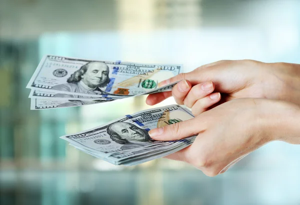 Female hand holding dollars — Stock Photo, Image