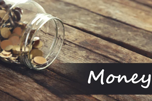 Coins in money jar — Stock Photo, Image