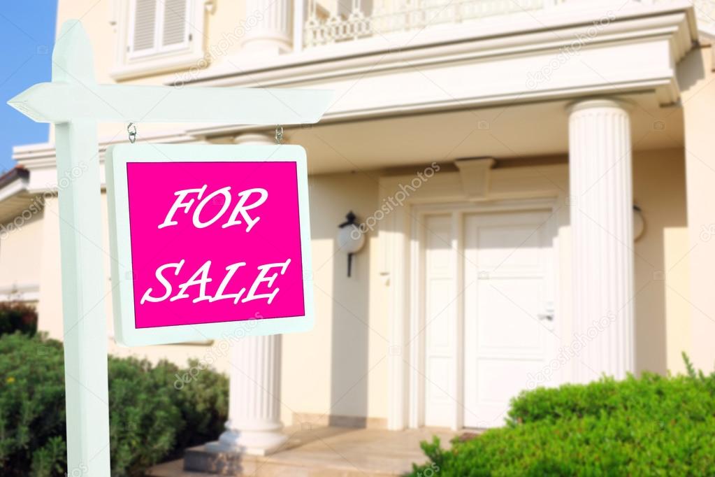 For Sale Real Estate Sign In Front Of New House Stock Photo