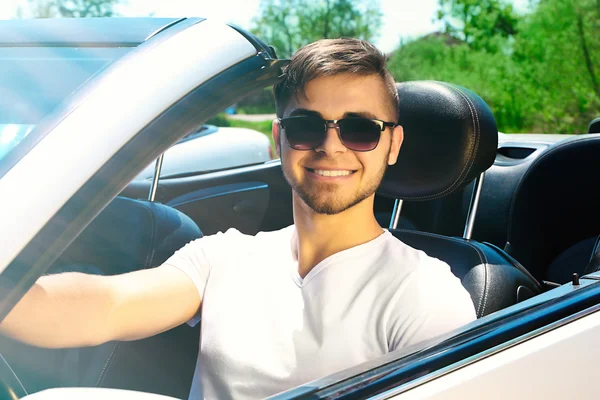 Young man in cabriolet, outdoors — Stock Photo, Image