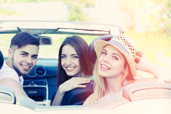 Three friends in cabriolet, outdoors — Stock Photo, Image