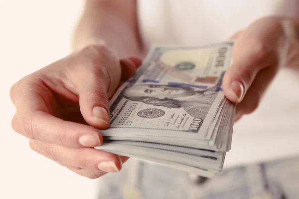 Female hands holding dollars, closeup — Stock Photo, Image