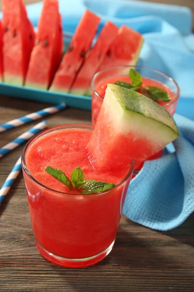 Glasses of watermelon juice on wooden table, closeup — Stock Photo, Image