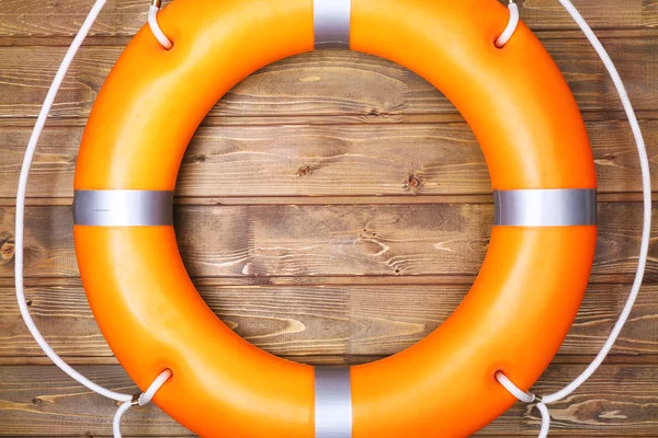 A life buoy on wooden wall — Stock Photo, Image