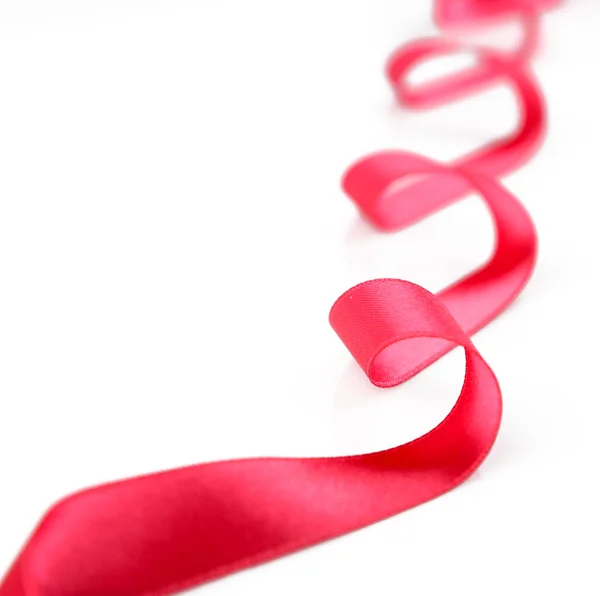 Pink curly ribbon isolated on white — Stock Photo, Image