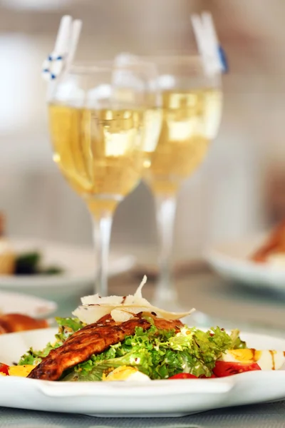 Tasty salad with served wine — Stock Photo, Image