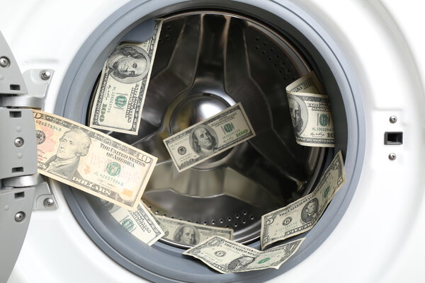 Money in washing machine, close up