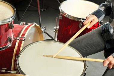 Drummer playing the drums closeup clipart