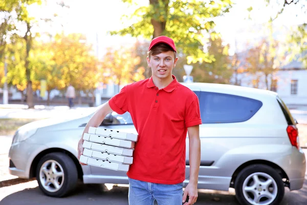 Delivery boy with pizza boxes — Stock Photo, Image