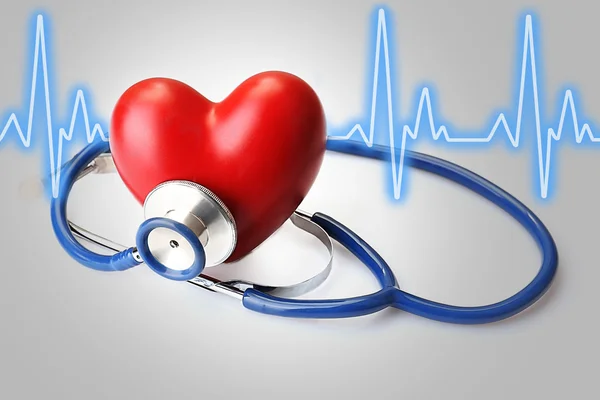 Stethoscope with heart and cardiogram — Stock Photo, Image