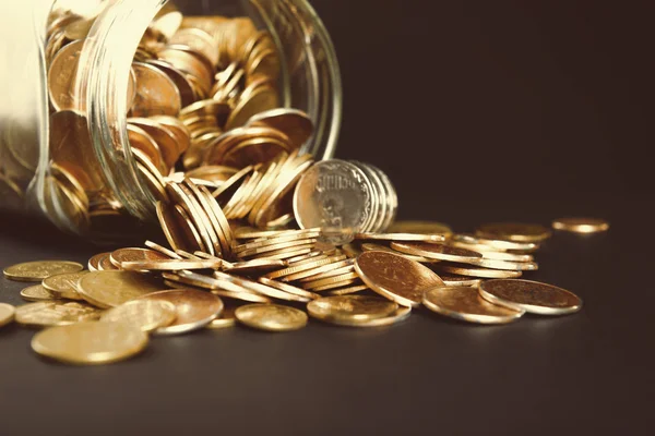 Glass jar with coins — Stock Photo, Image