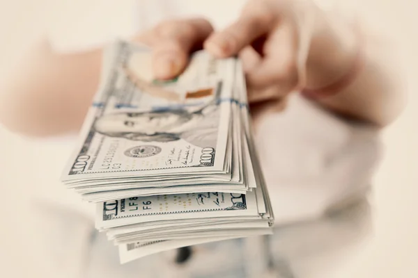 Hands holding dollars — Stock Photo, Image