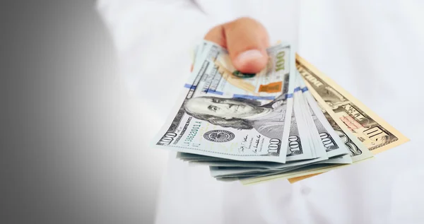 Hand with dollars banknotes — Stock Photo, Image