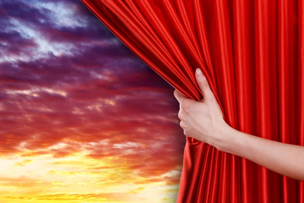 Hand opens curtain on sky — Stock Photo, Image