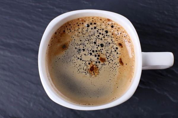 Xícara de café na mesa de perto — Fotografia de Stock